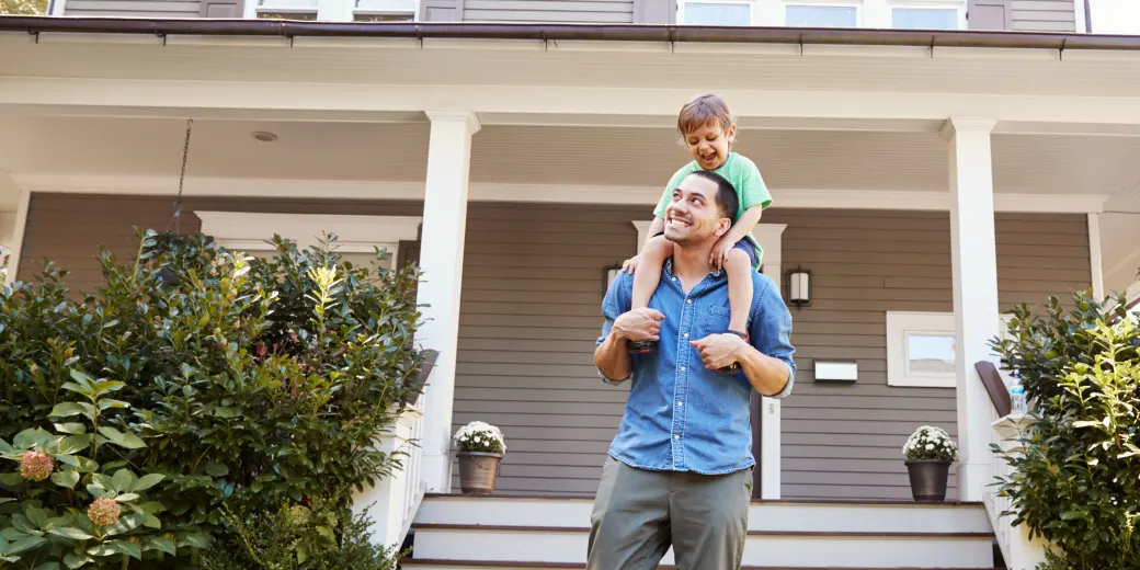 Man with young son on shoulders
