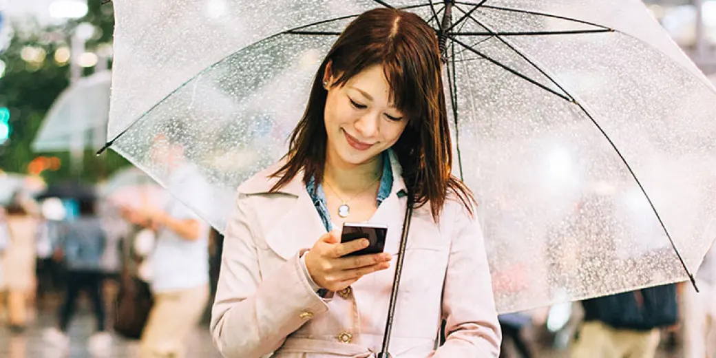 Woman on phone in rain